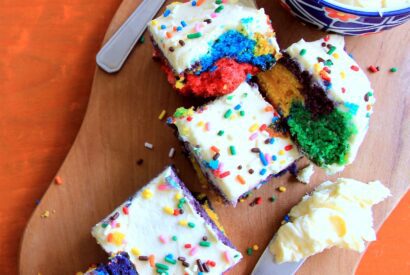 Thumbnail for Eggless Rainbow Cake With Cream Cheese Frosting Recipe by Veena Theagarajan